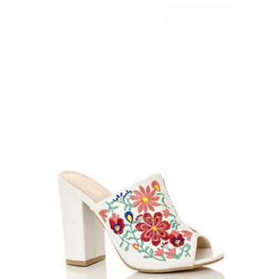 White embroidered mules